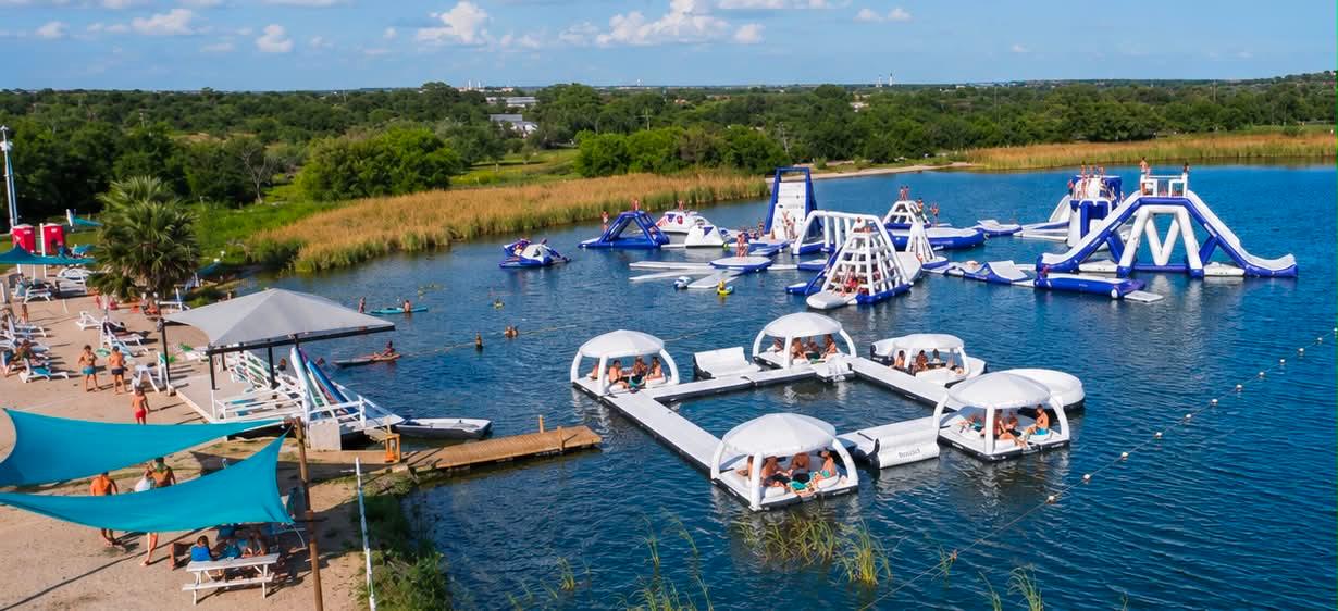 Aerial view of the Stoke Factory Aqua Park with floating Aqua Cabanas in New Braunfels, TX
